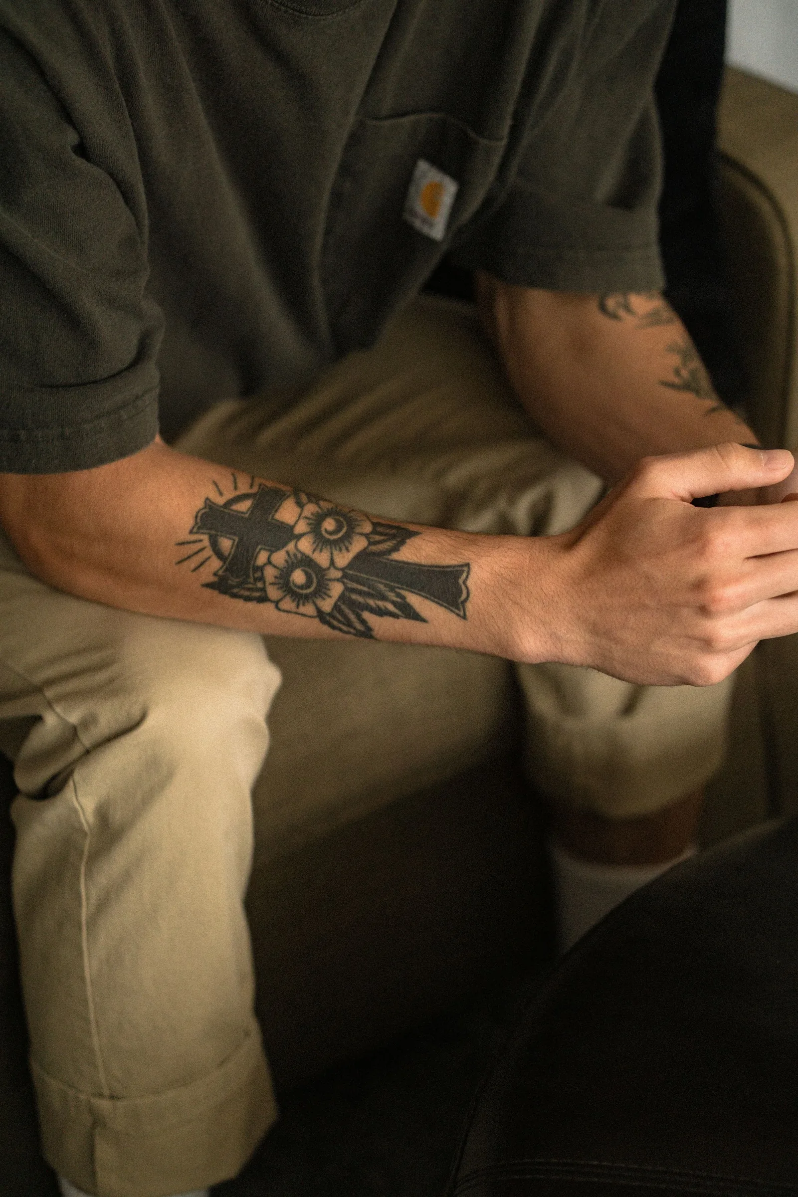 Black rose sleeve on a forearm